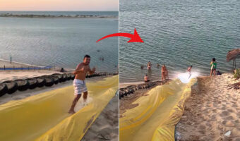 これは爽快!ビーチに作ったウォータースライダーを立って滑っていく男性。着水する時も一味違うところを見せてくれました!!